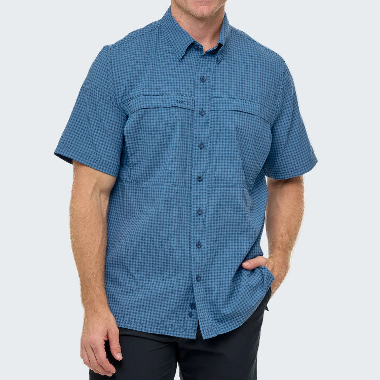 Man wearing a blue checkered short-sleeve shirt on a white background