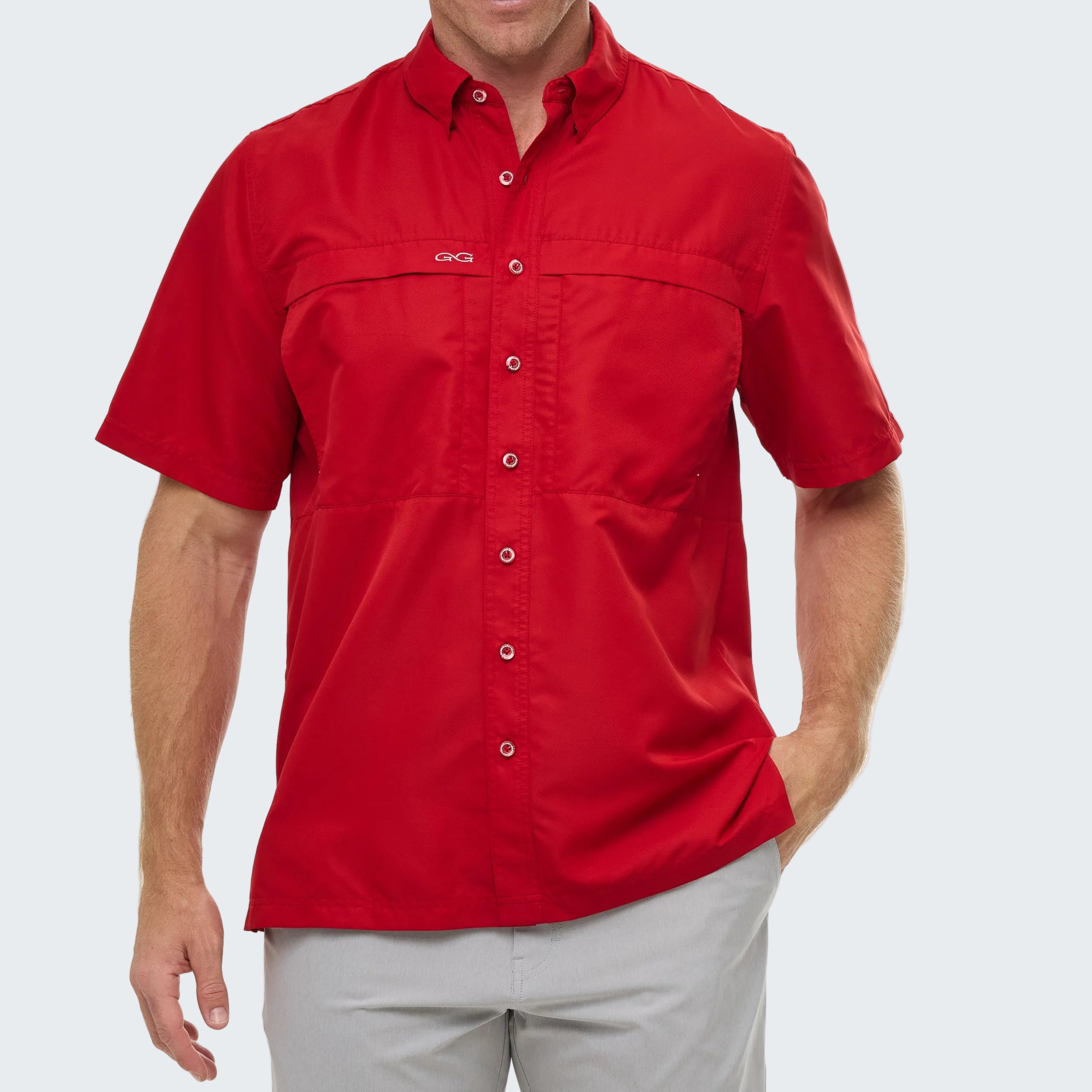 Red short-sleeve shirt worn by a person on a white background