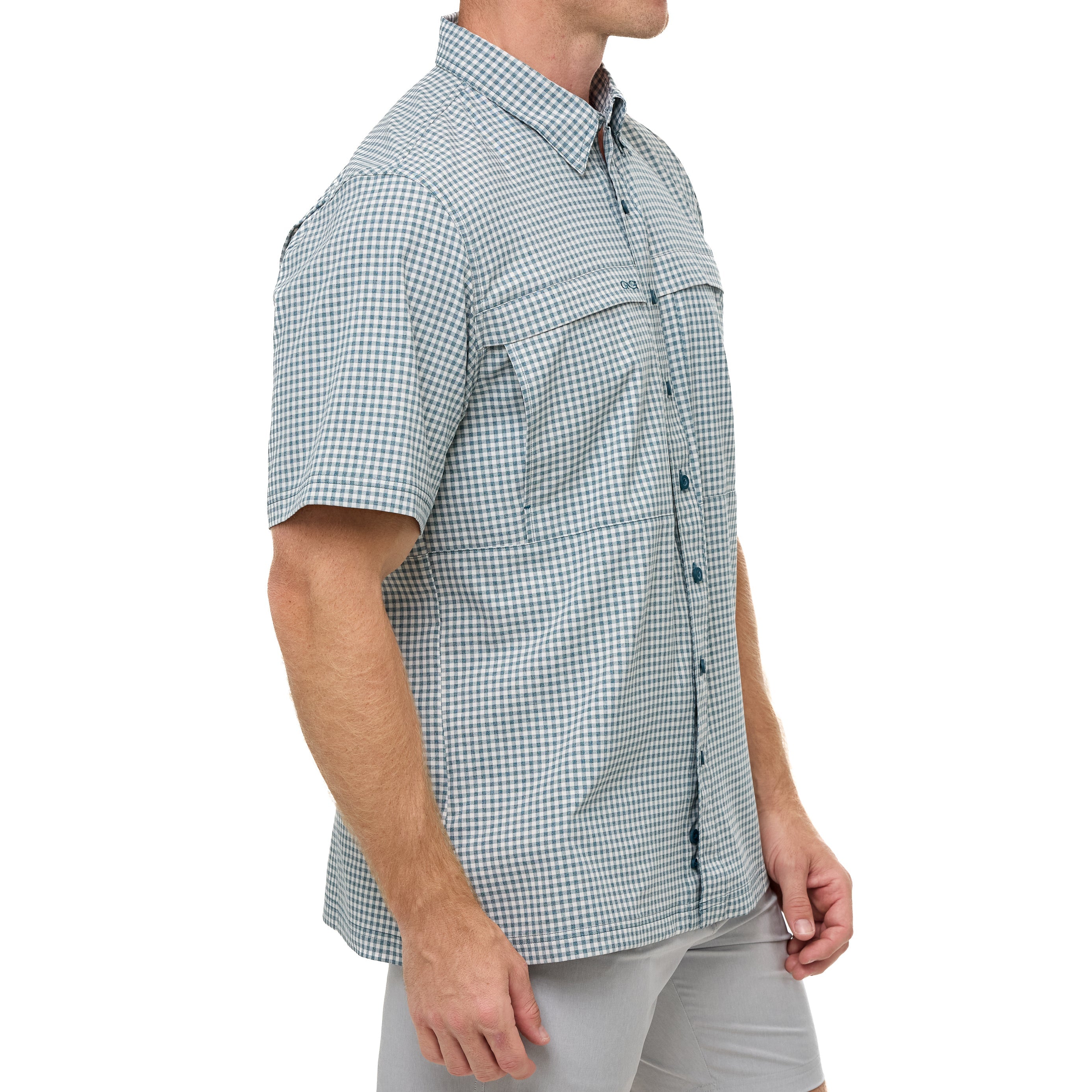 Man wearing a green and white checkered short-sleeve shirt on a white background