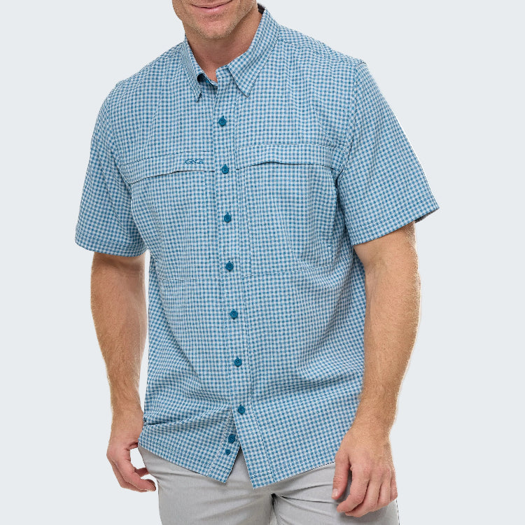 Man wearing a blue checkered short-sleeve shirt on a white background
