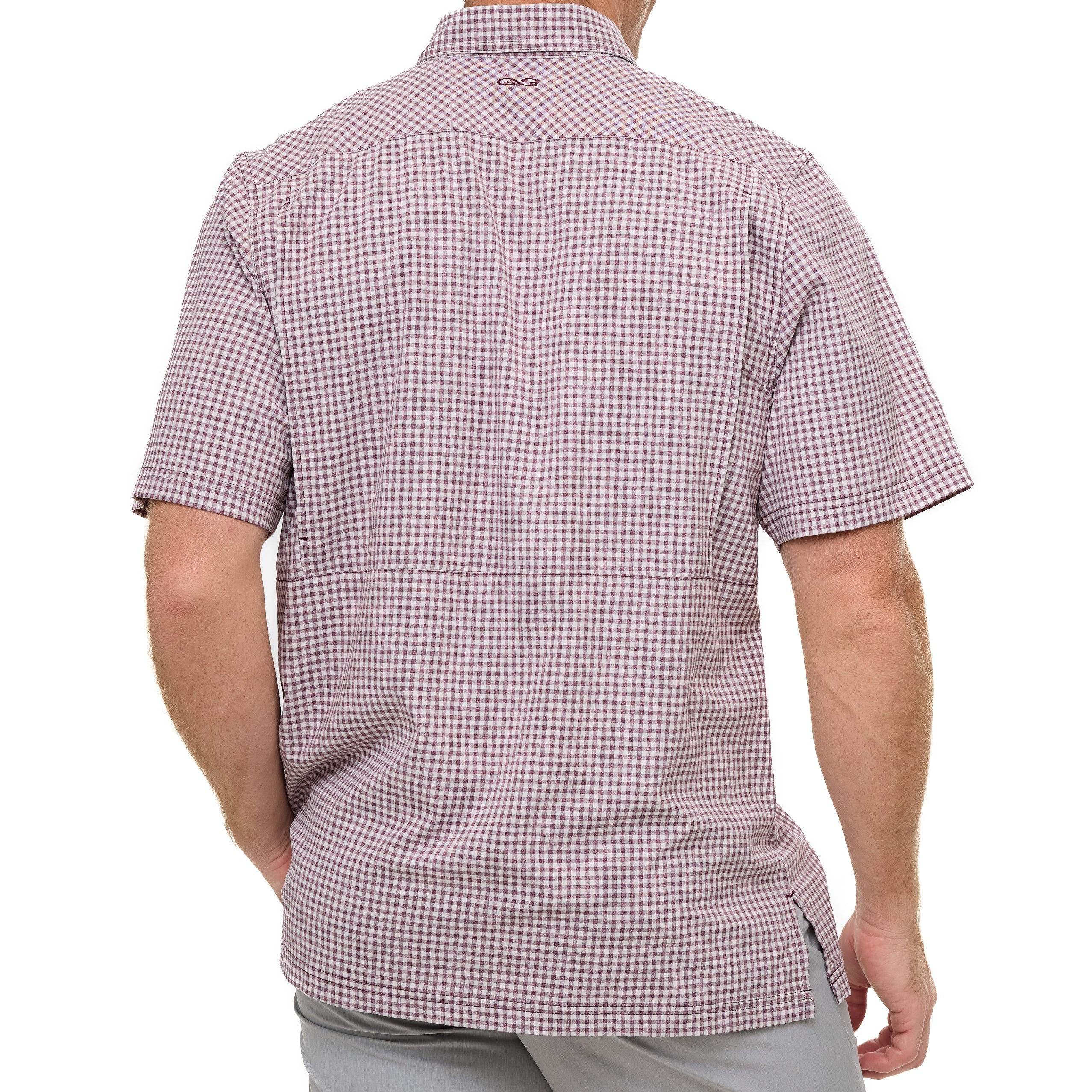 Checkered short-sleeve shirt worn by a person on a white background