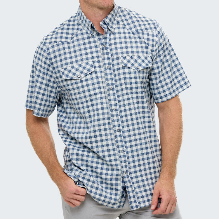 Man wearing a blue and white checkered short-sleeve shirt on a white background