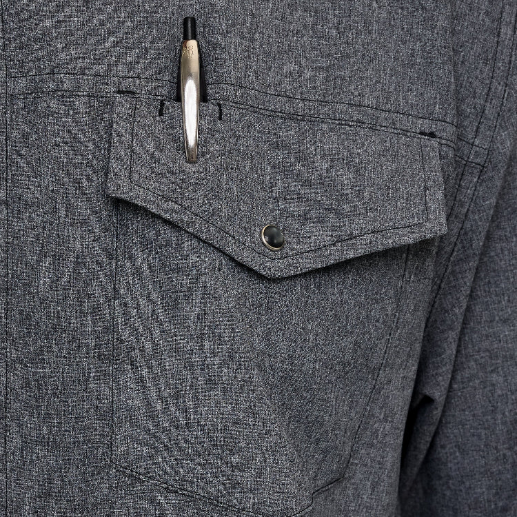 Close-up of a gray fabric pocket with a pen inside