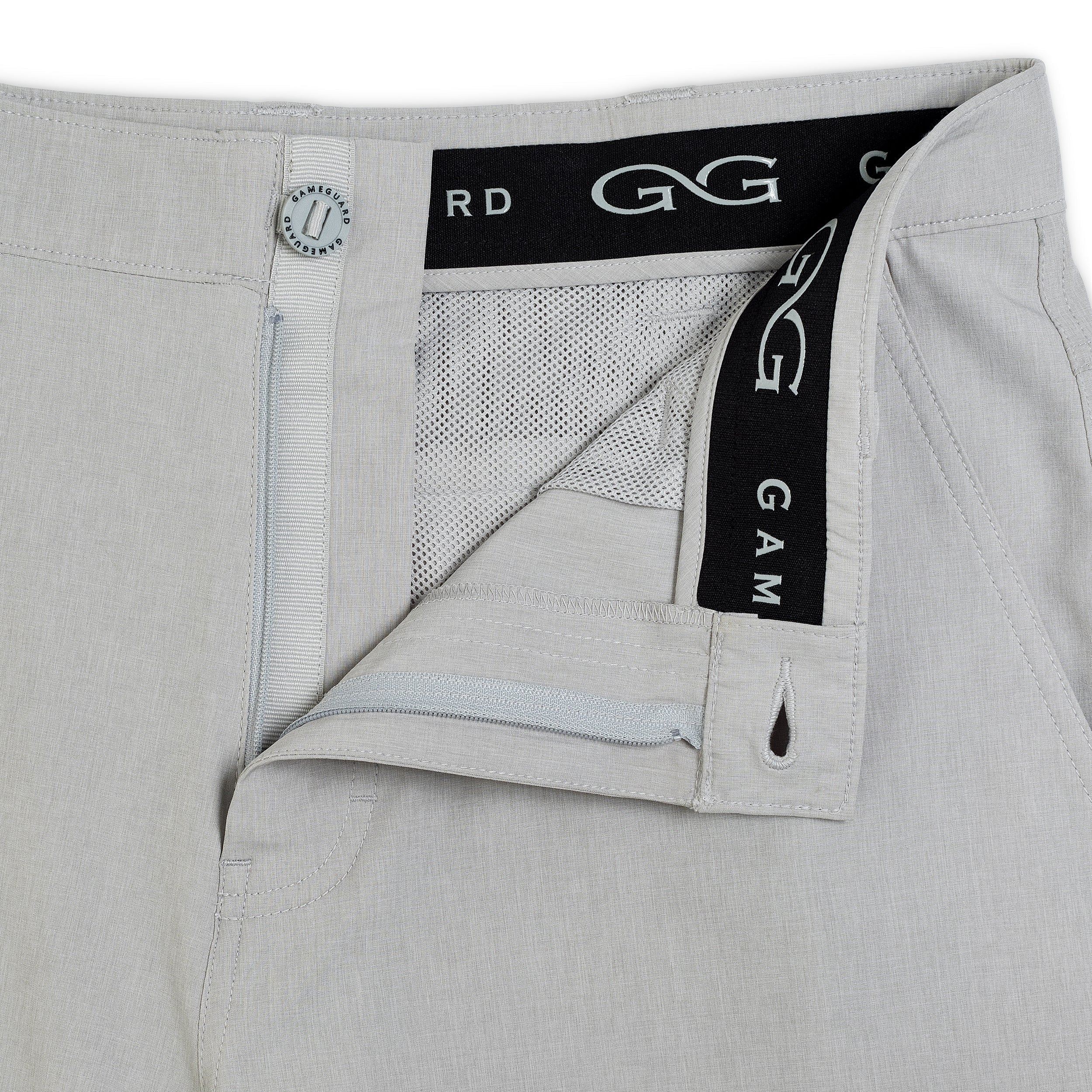 Close-up of gray pants with a brand label on a white background