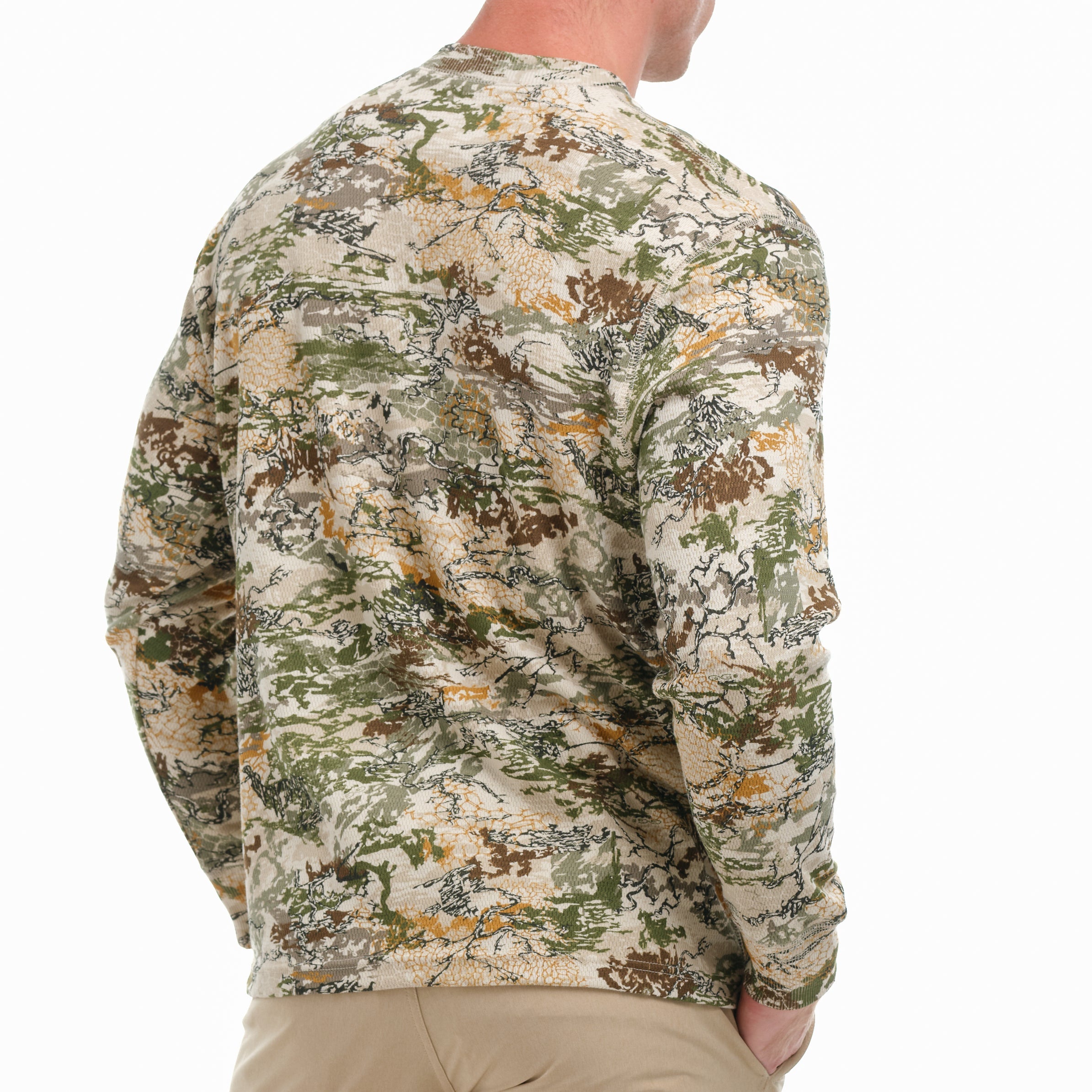 Camouflage-patterned shirt worn by a person on a white background