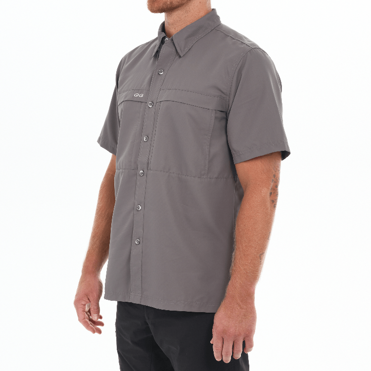 Man wearing a gray short-sleeve shirt on a white background