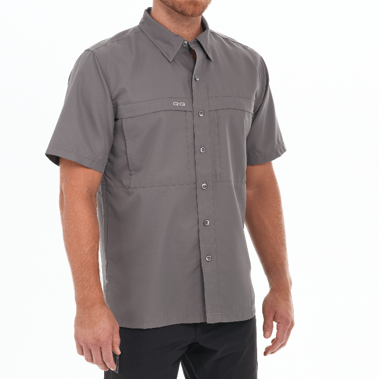 Man wearing a gray short-sleeve shirt on a white background