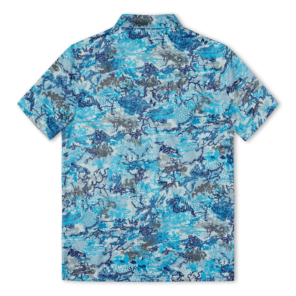 A short-sleeve camp collar shirt shown from the back, featuring an all-over abstract camouflage pattern in shades of blue, gray, and white.