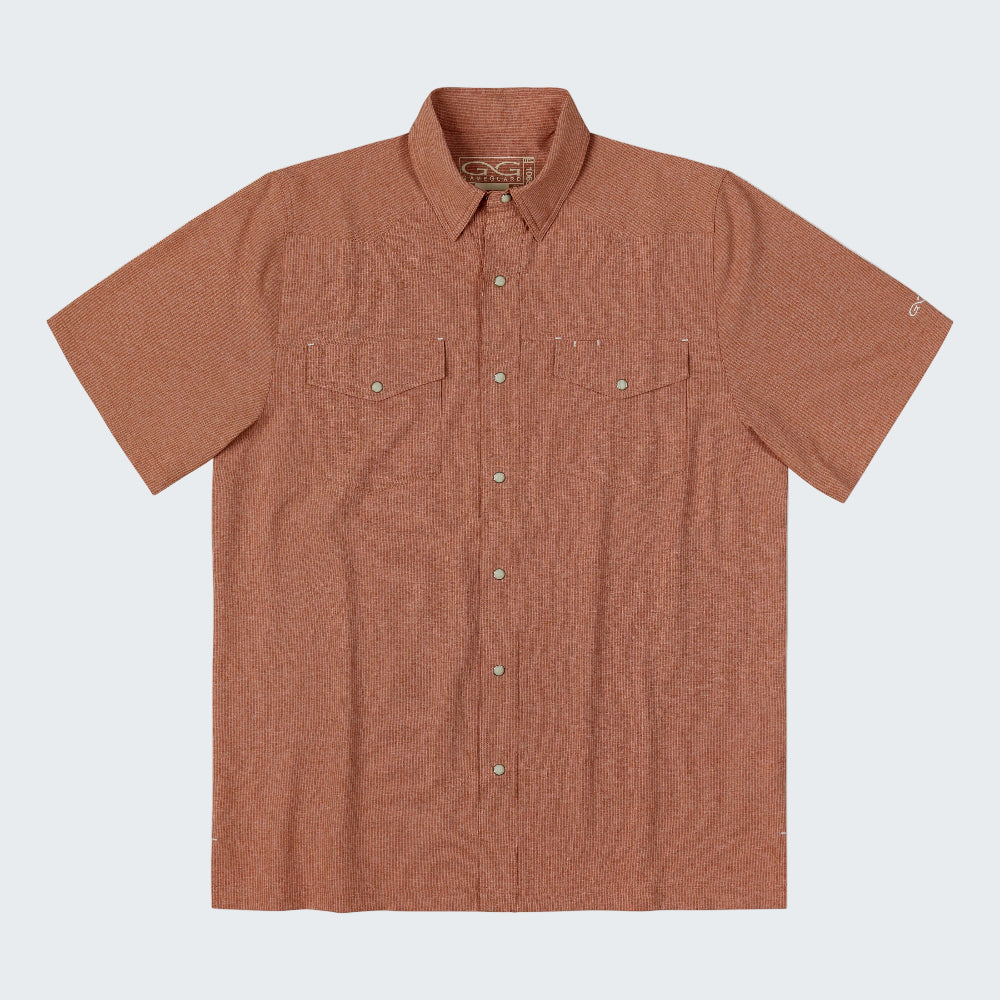 A short-sleeve button-up shirt in a heathered terracotta or rust orange color, featuring two chest flap pockets with silver-tone snap buttons and a matching button-down front. The shirt is laid flat against a clean white background.