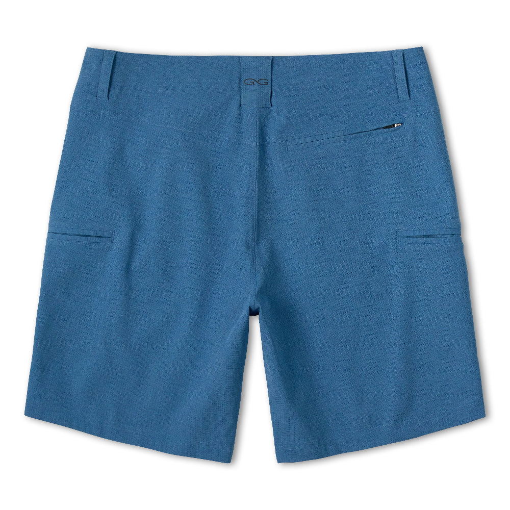 A pair of blue shorts with a flat front, featuring side pockets and a button closure, shown against a plain white background.