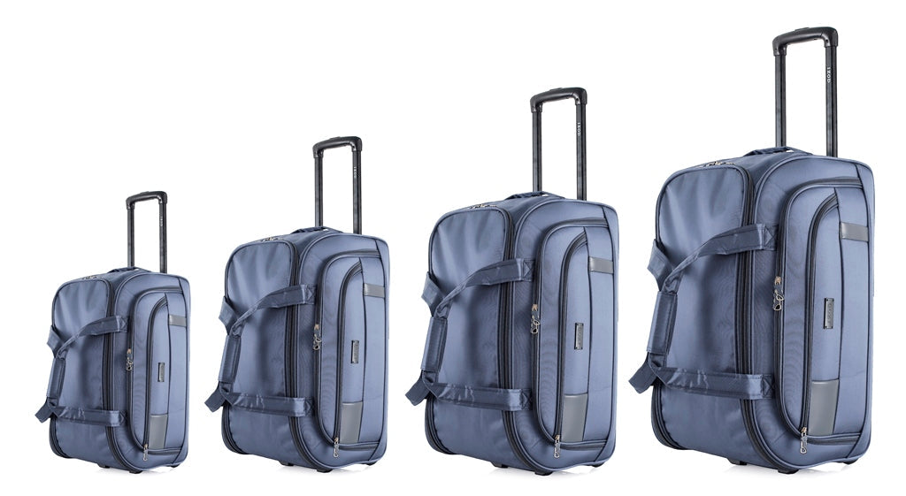 Set of four blue suitcases of different sizes on a white background