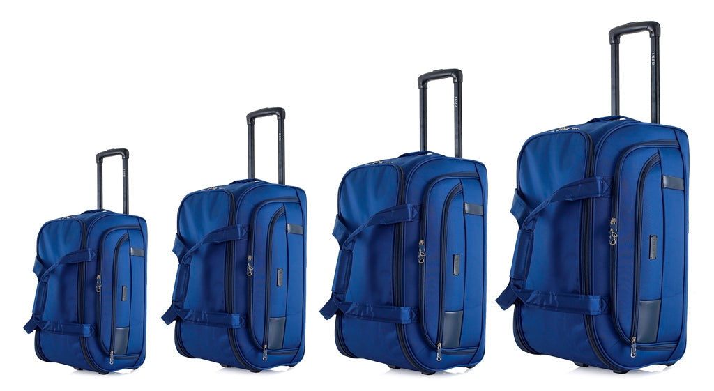 Four blue suitcases of different sizes on a white background