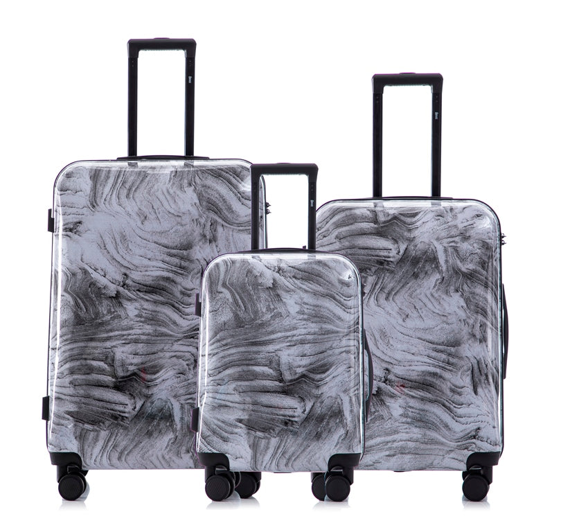 Set of three gray marbled suitcases with wheels on a white background