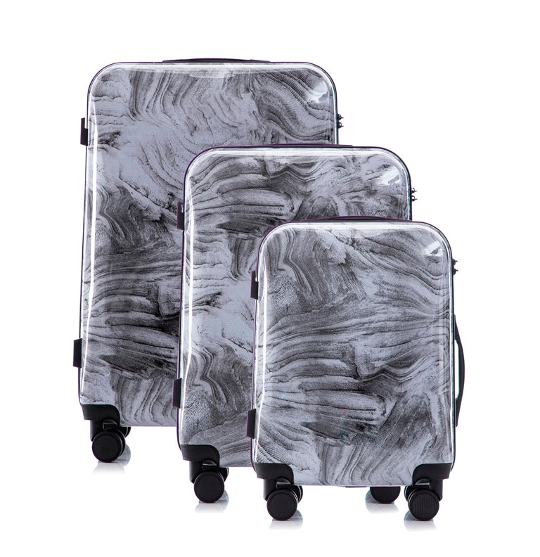 Set of three gray marbled suitcases on a white background