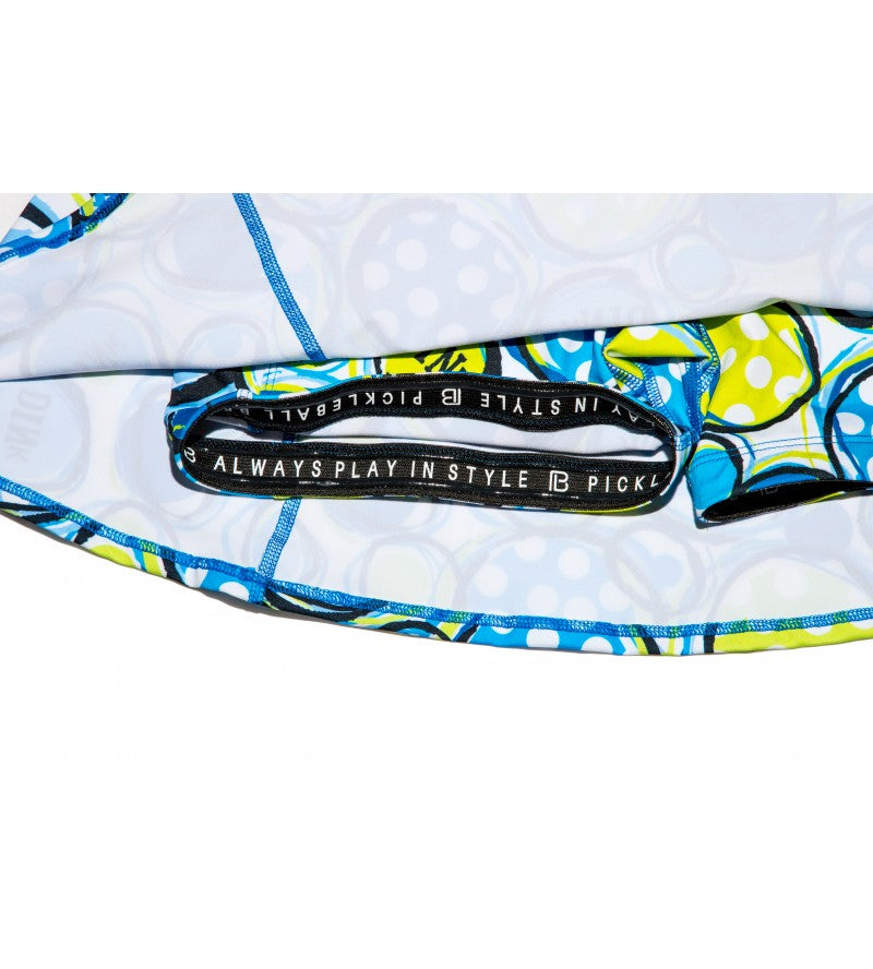 Close-up of a colorful bag with a brand logo and text on a white background