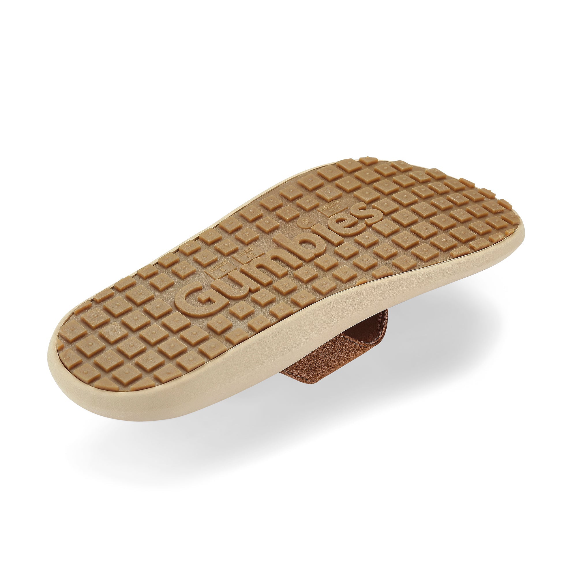 Brown sole of a sandal with 'Gumbies' branding on a white background