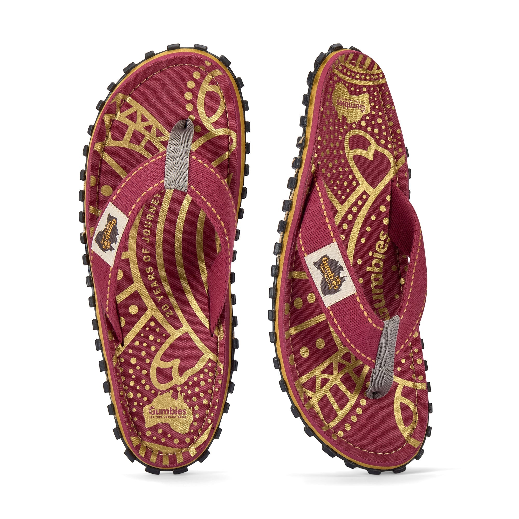 Red and gold flip-flops with 'Gumbies' branding on a white background