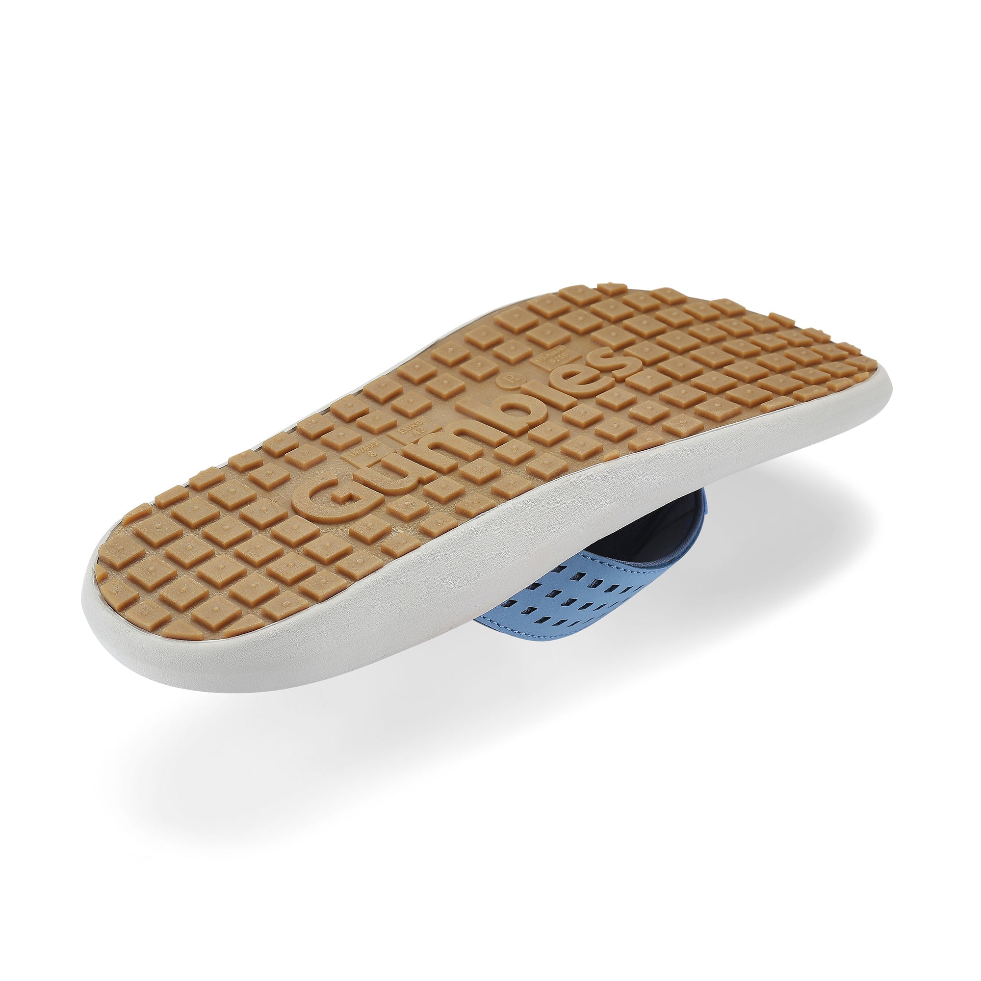 White shoe sole with brown textured surface on a white background