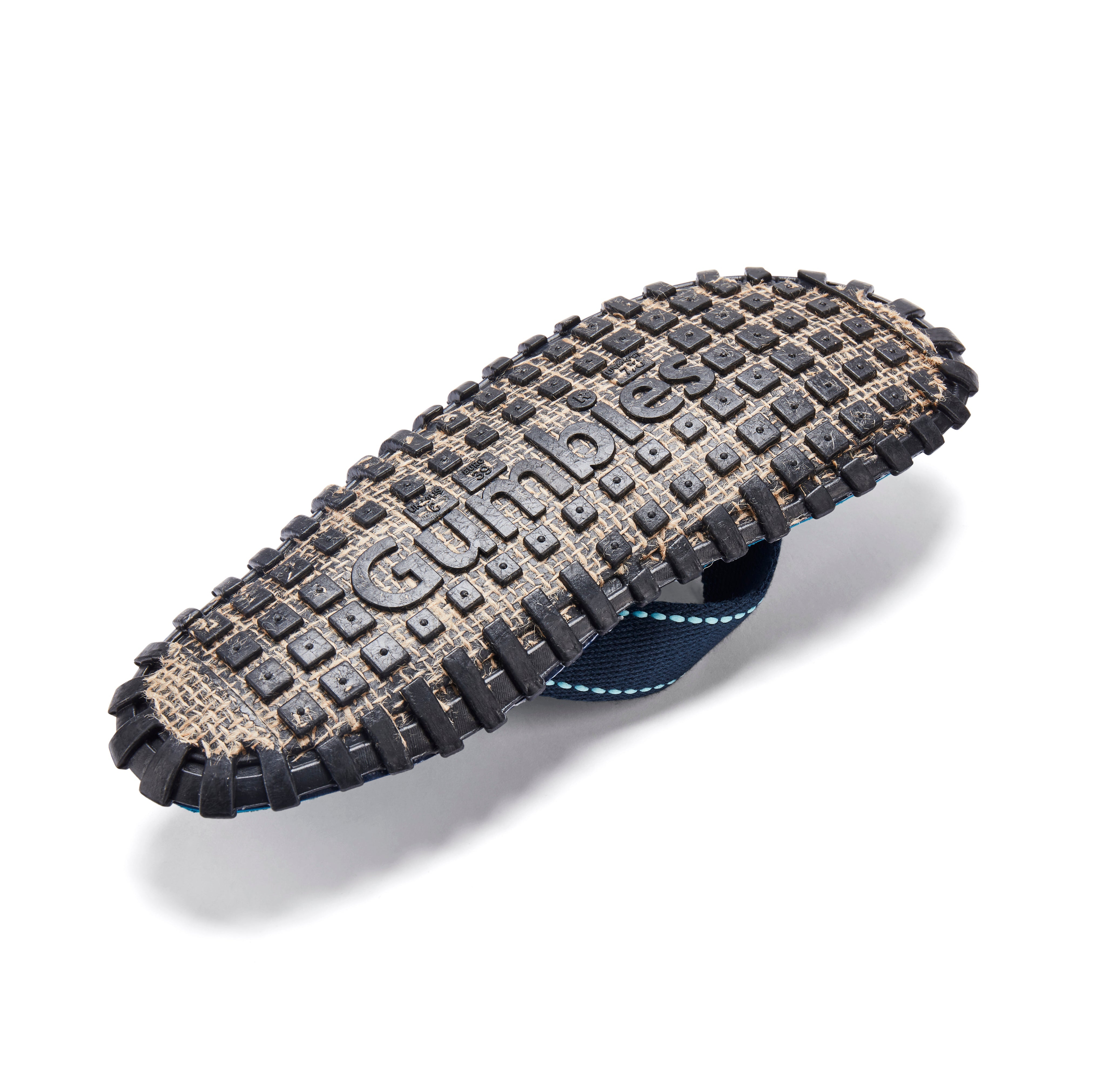 Gumout tire track pattern on a white background