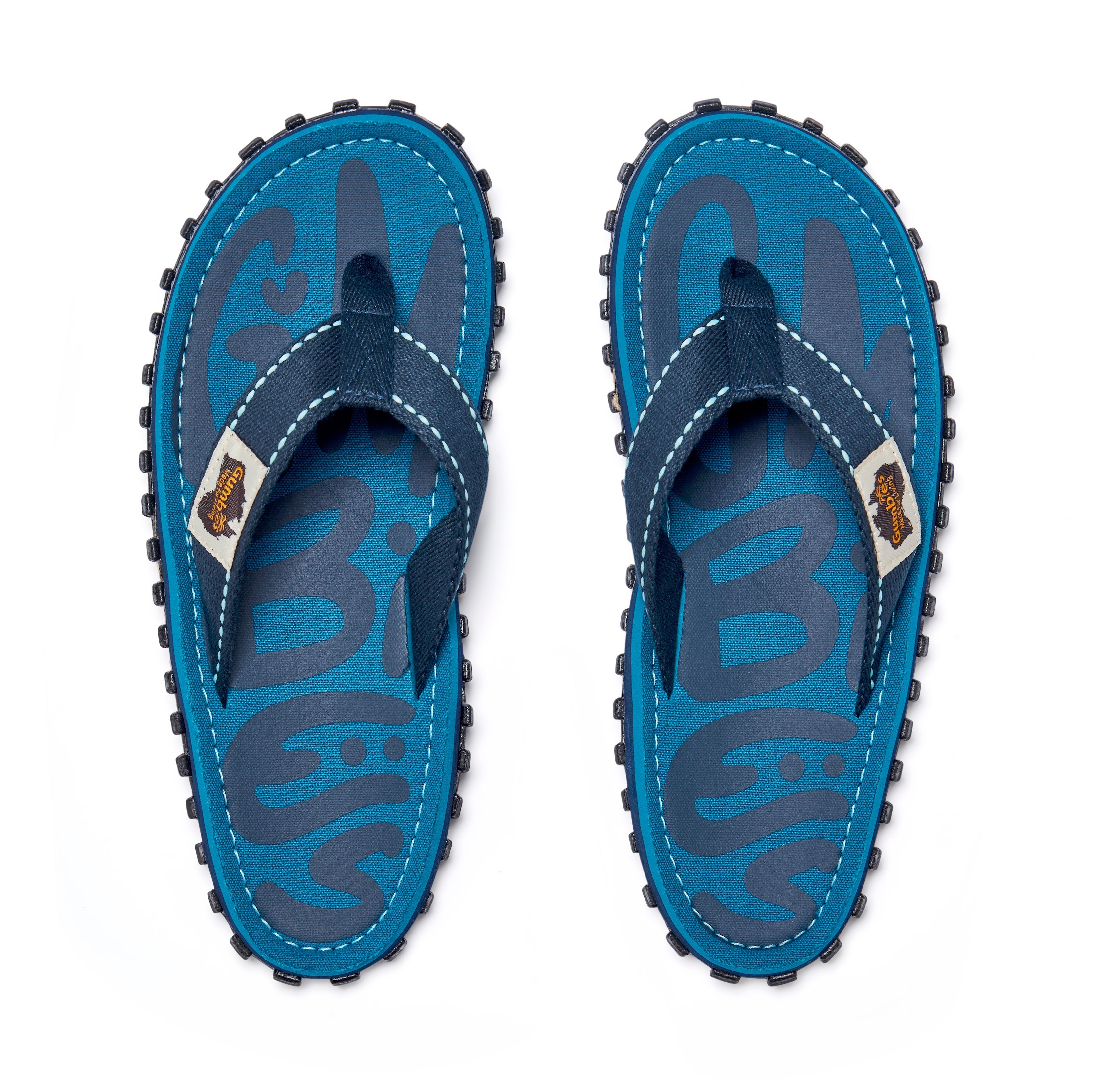 Pair of blue sandals with black soles on a white background