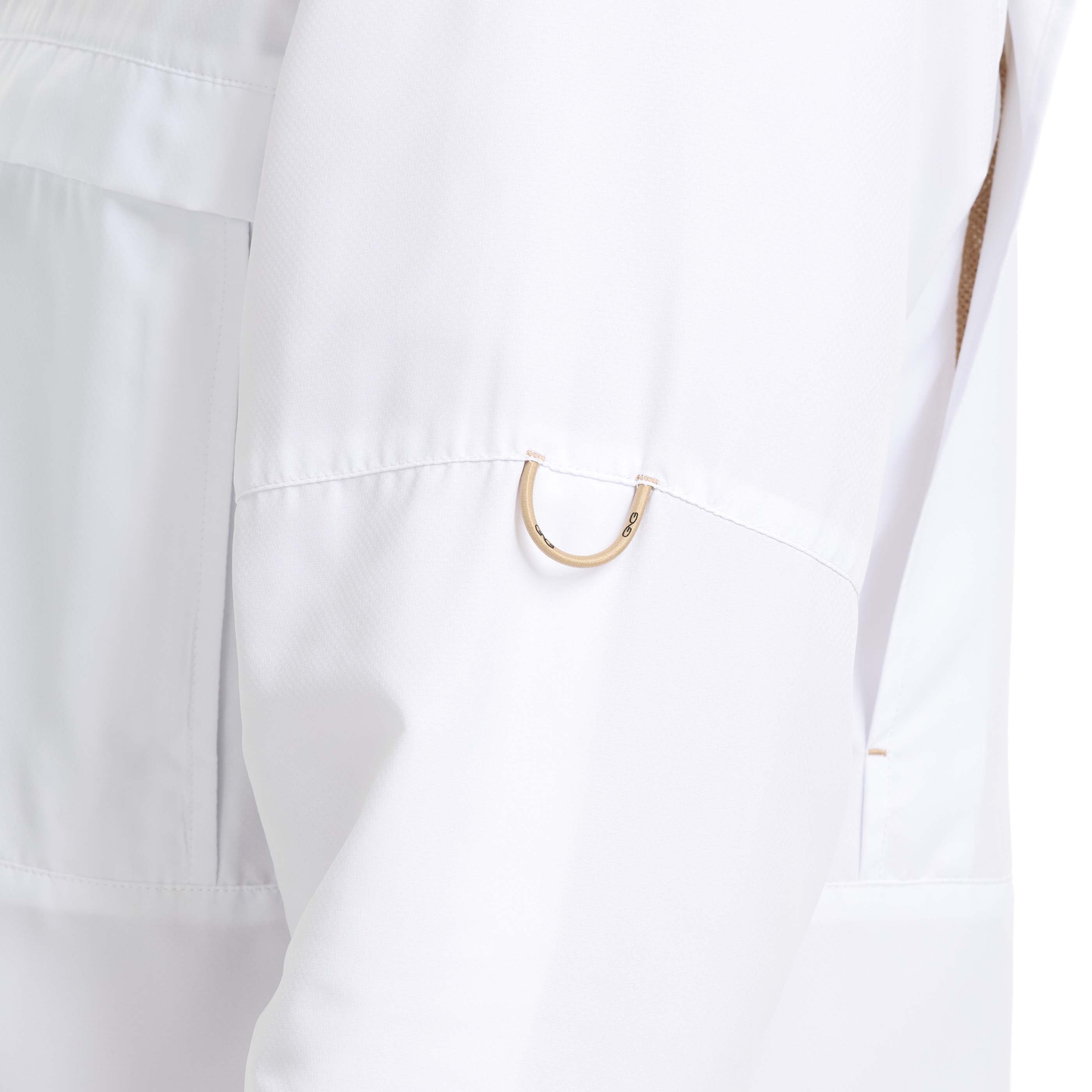Close-up of a white lab coat with a gold button on a white background