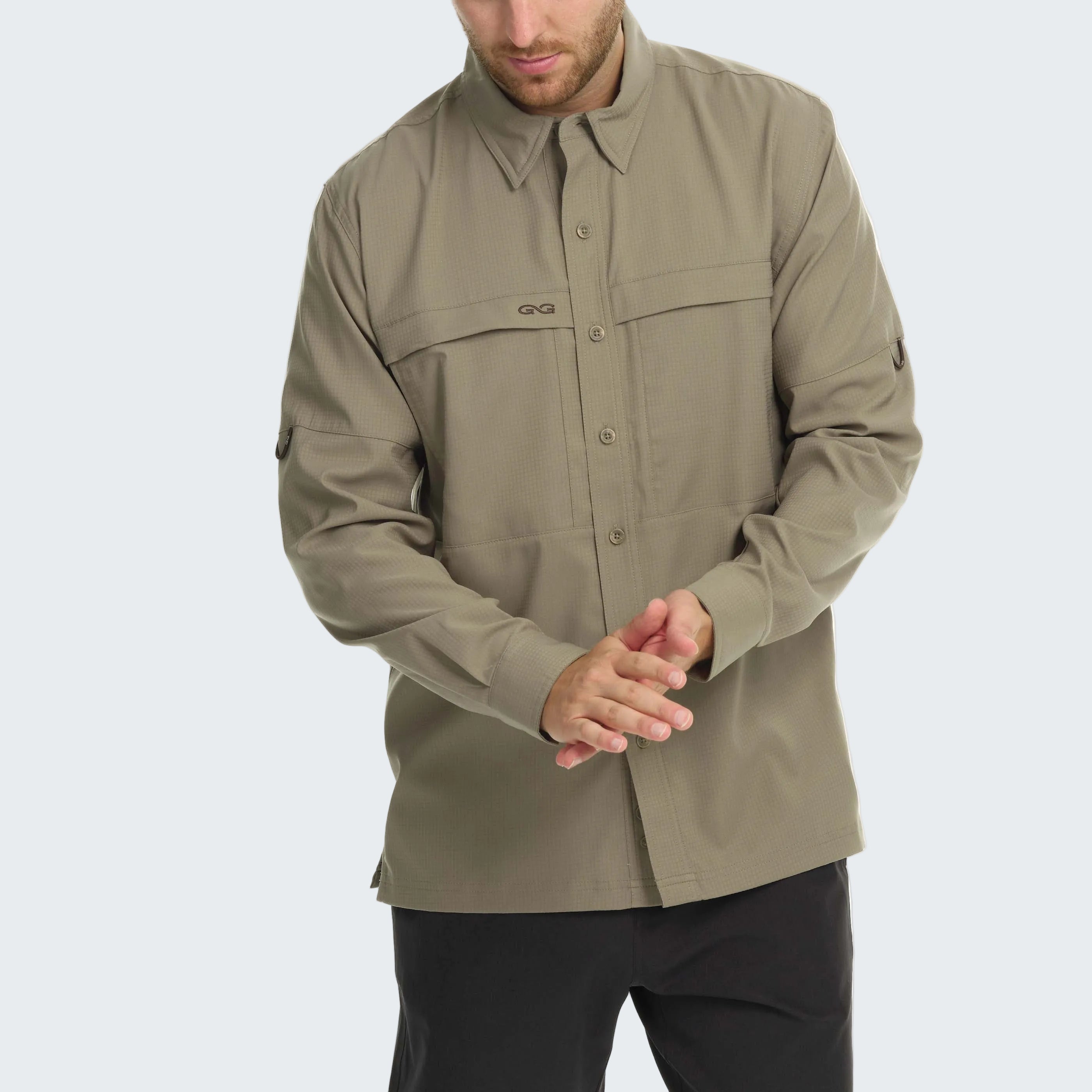 Man wearing a beige button-up shirt on a white background