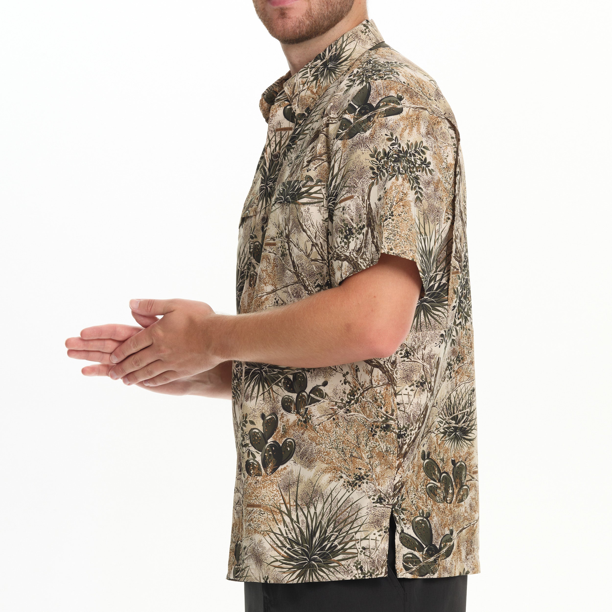 Man wearing a patterned shirt on a white background