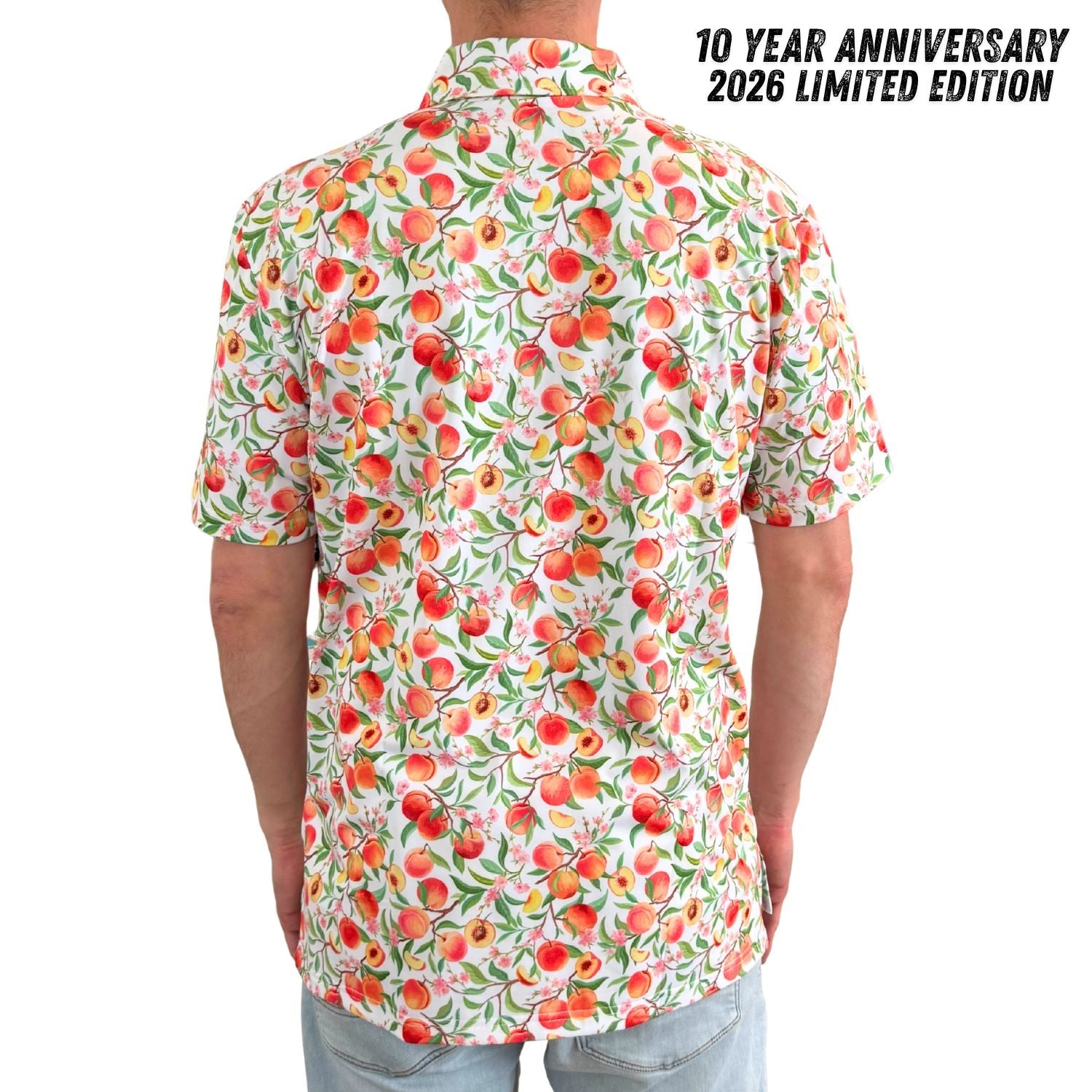 Person wearing a colorful shirt with peach pattern, 10 Year Anniversary 2026 Limited Edition text.