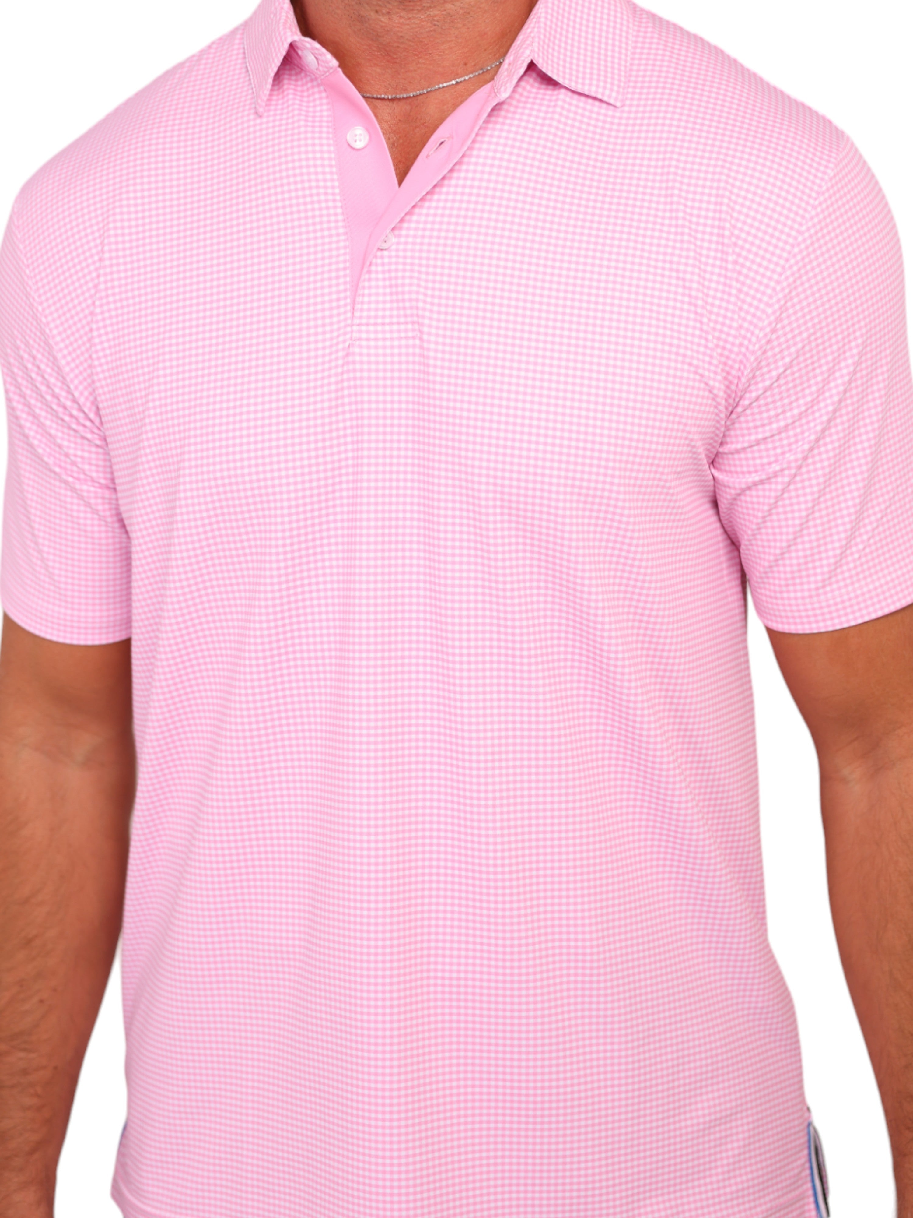 Pink checkered polo shirt worn by a person on a white background