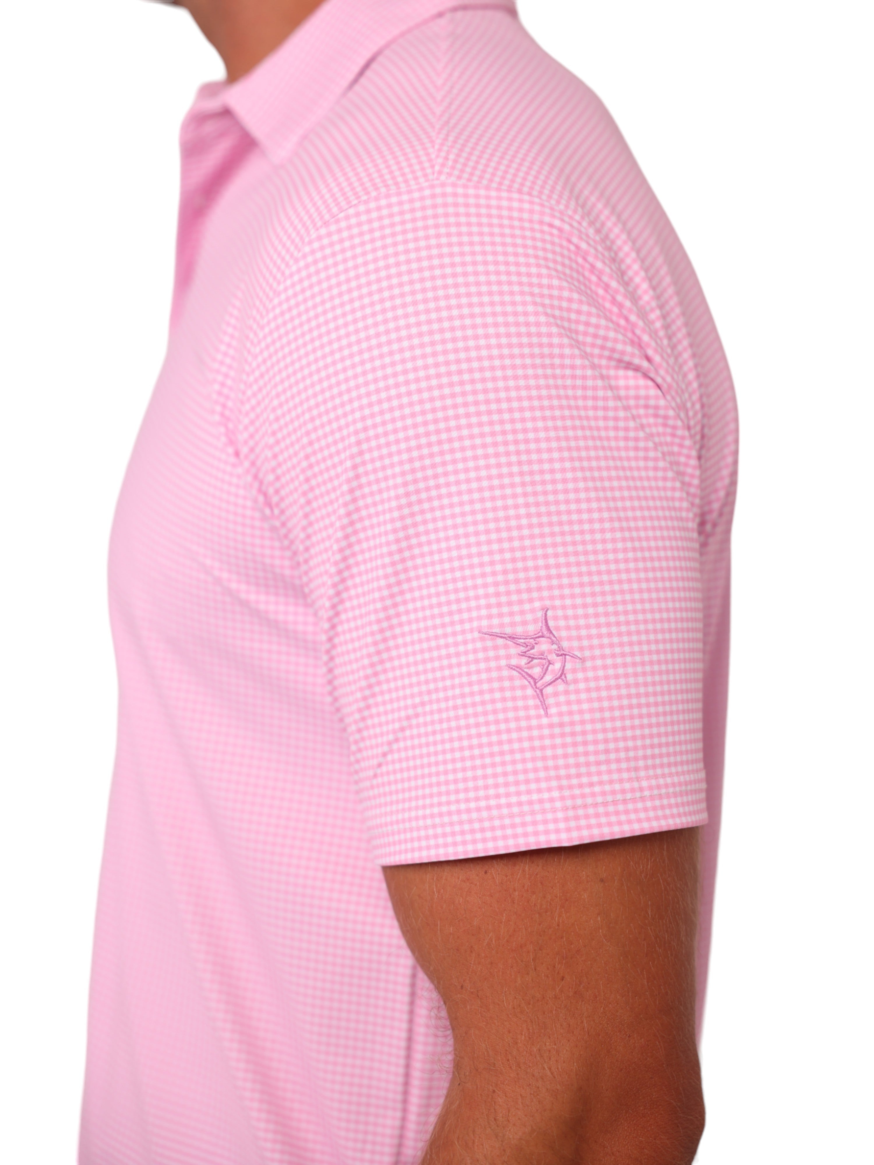 Pink checkered polo shirt worn by a person on a white background