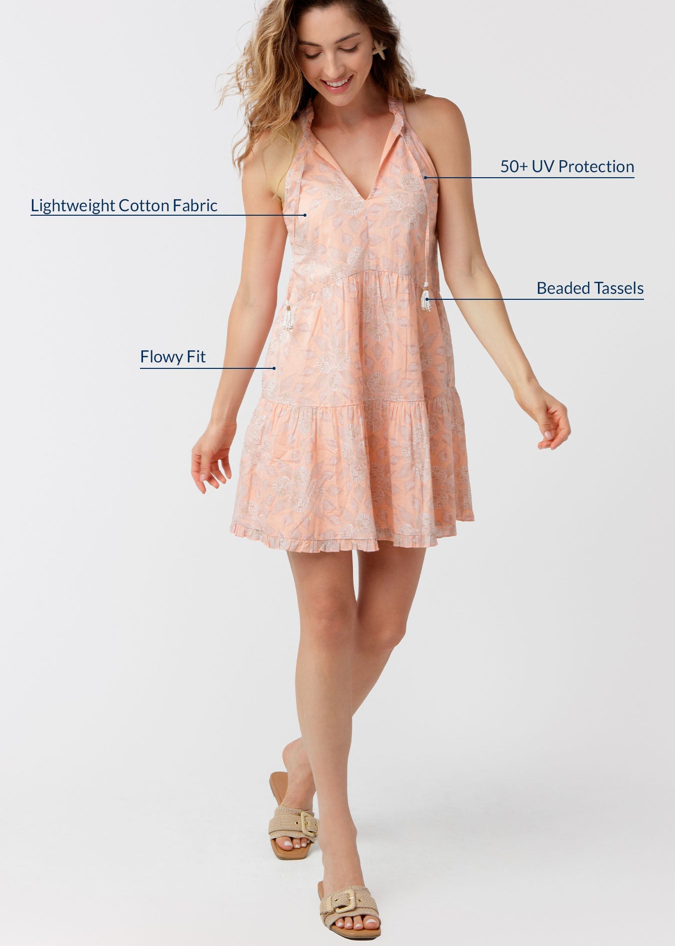 Woman wearing a peach-colored dress with text highlighting features on a white background