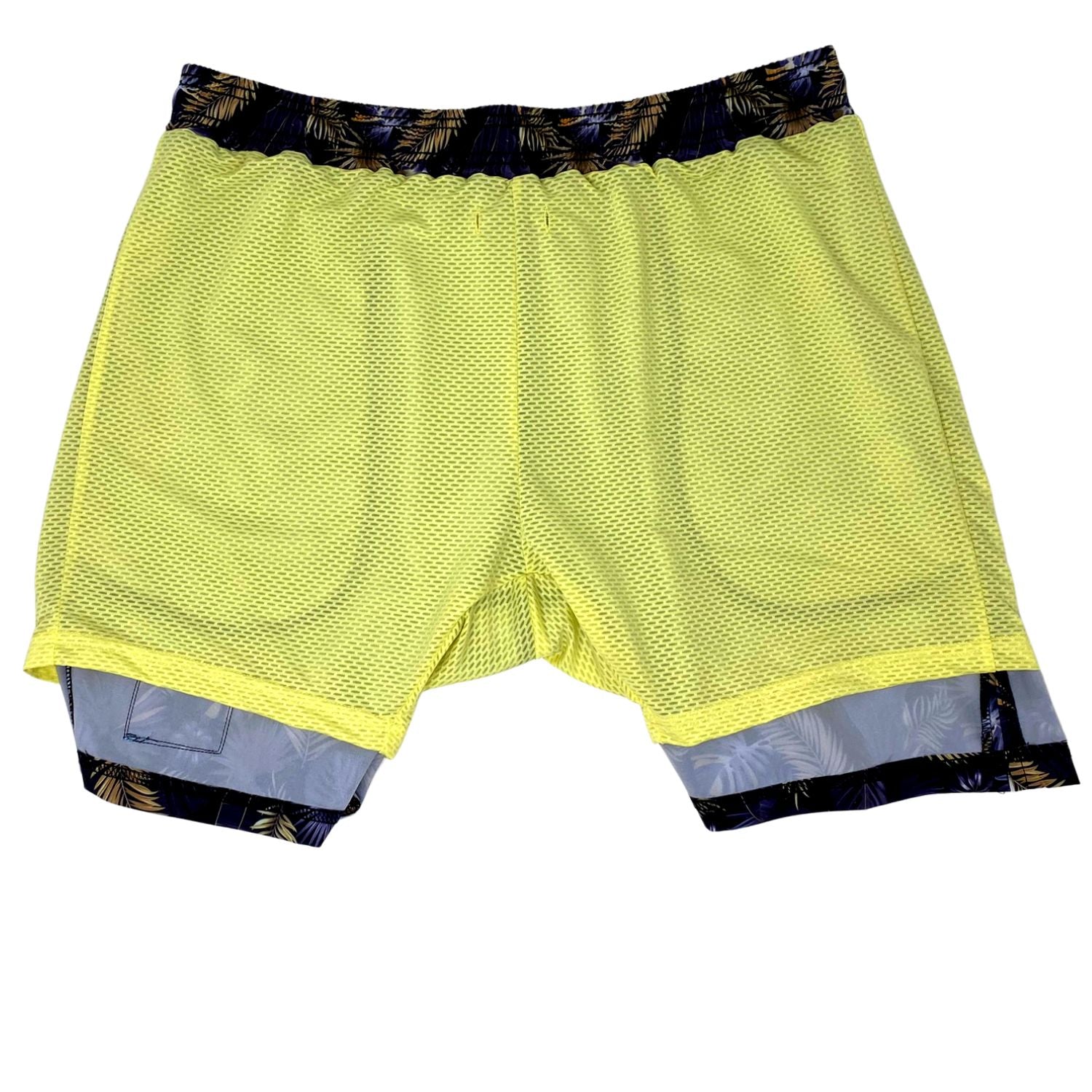 Yellow athletic shorts with patterned waistband and hem on a white background