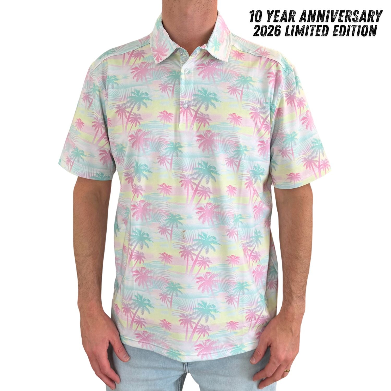 Person wearing a colorful palm tree patterned shirt with text indicating a 10-year anniversary.