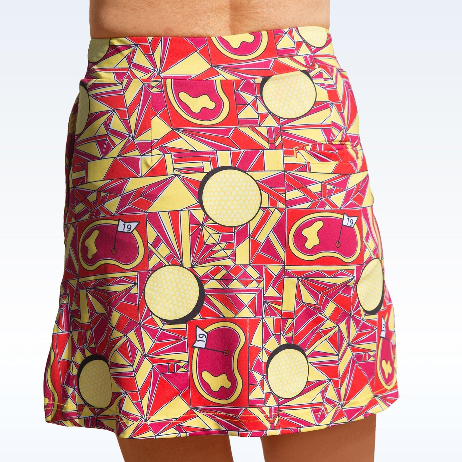 Skirt with geometric red and yellow pattern on a white background