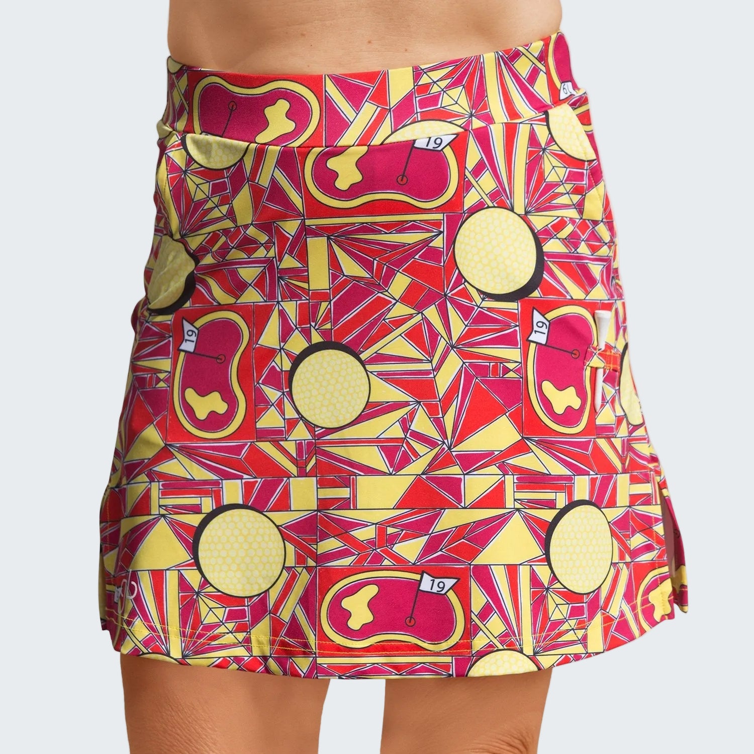 Colorful patterned skirt with geometric design on a white background