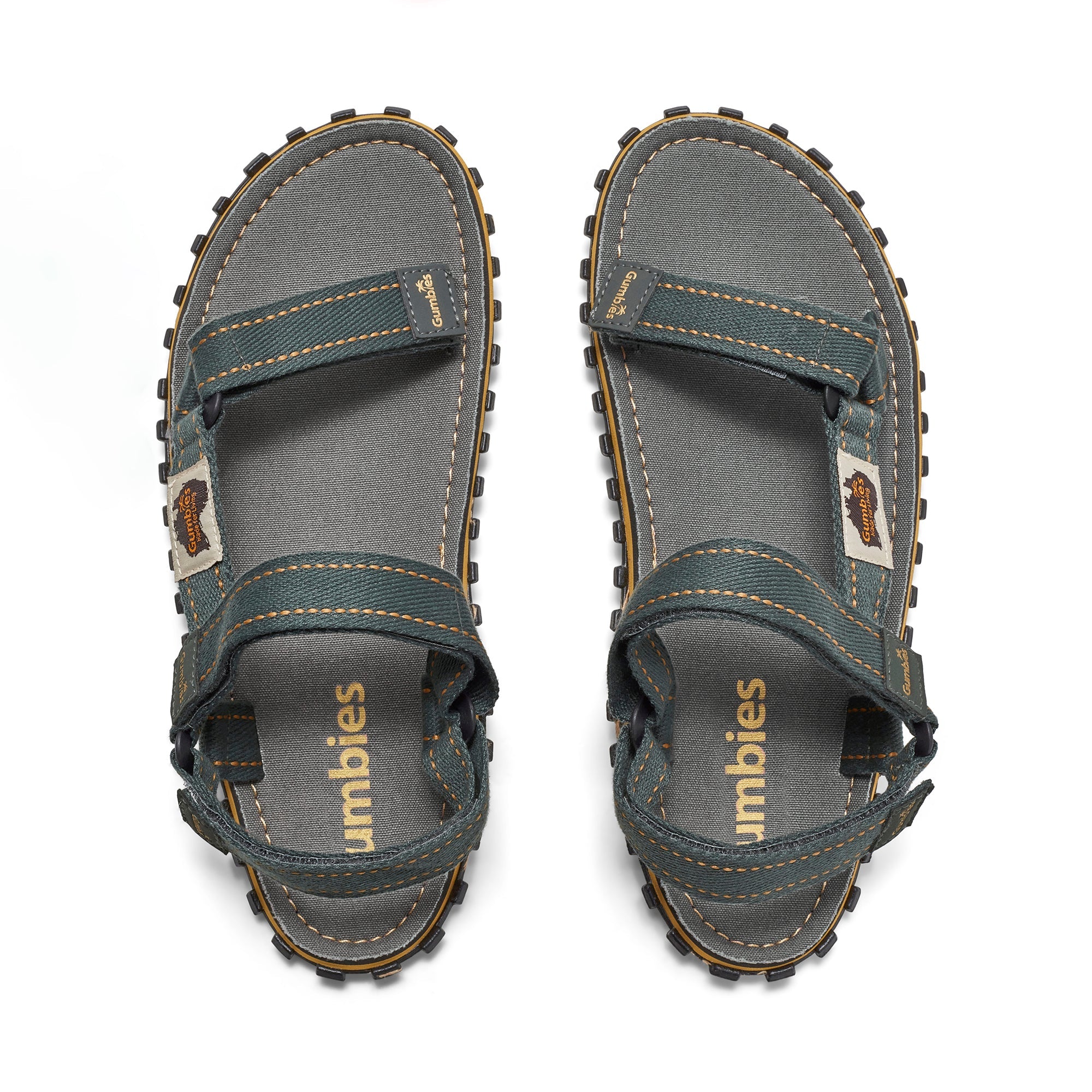 Pair of gray sandals with strap details on a white background