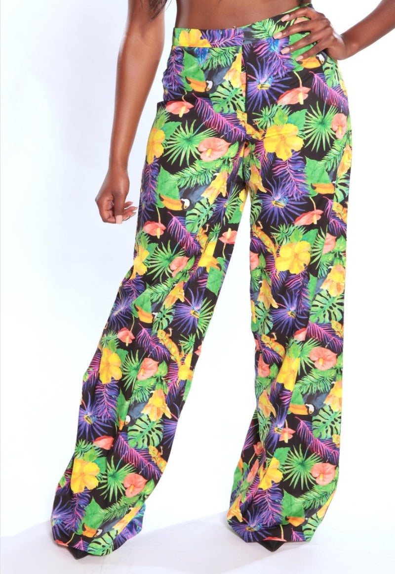 Colorful tropical patterned pants on a white background