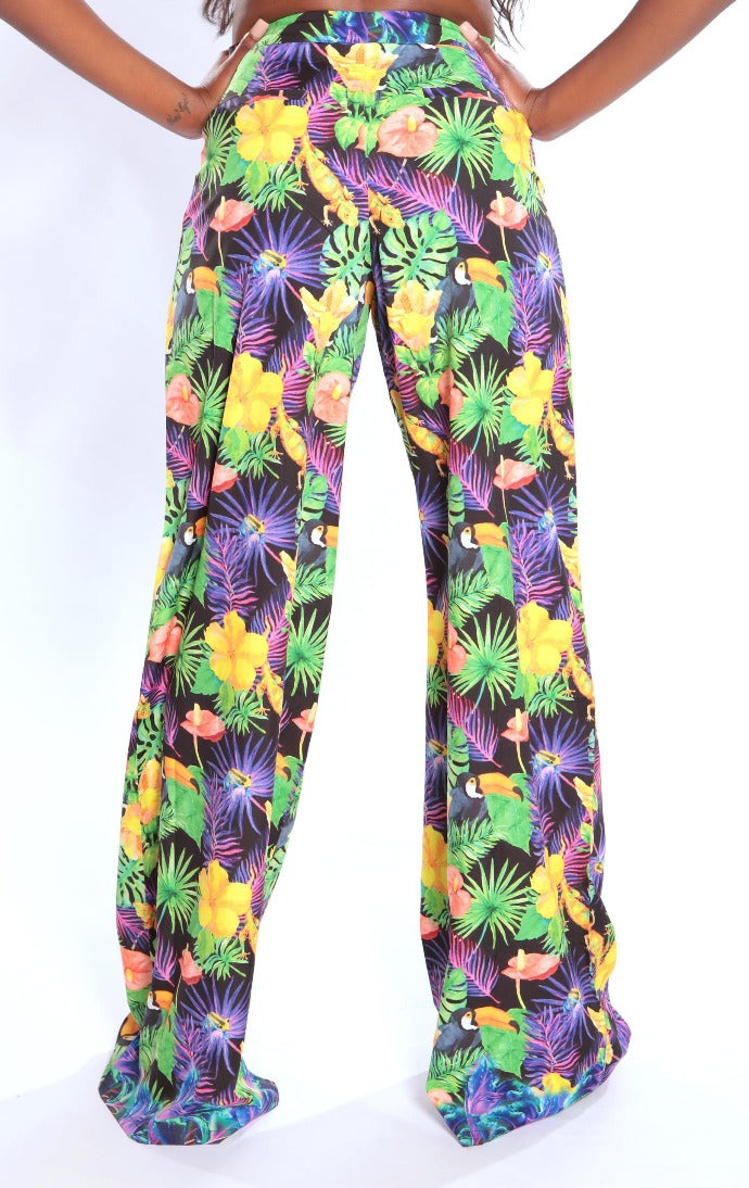 Colorful tropical print pants on a white background