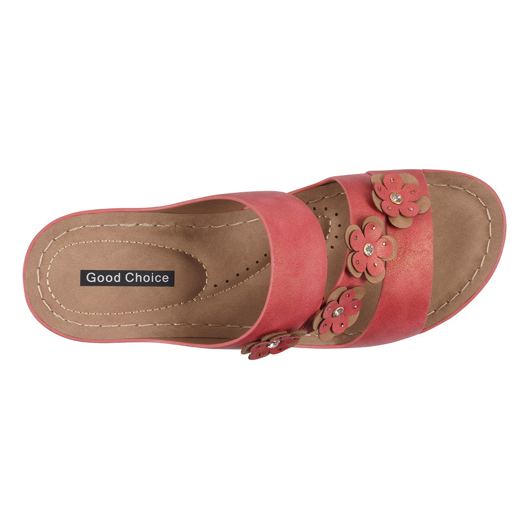 Pink sandal with floral designs on a white background