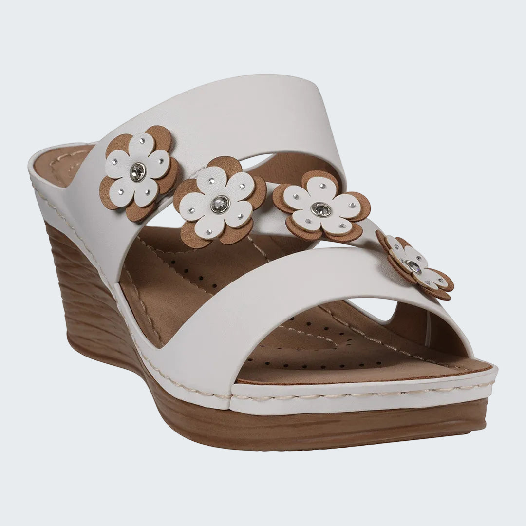 White sandal with brown flowers on a white background