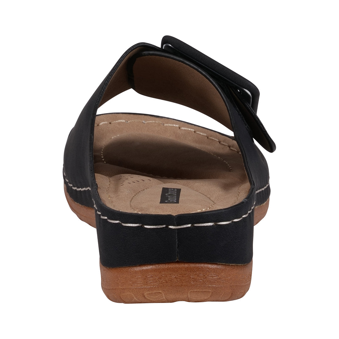 Black sandal with a brown sole on a white background