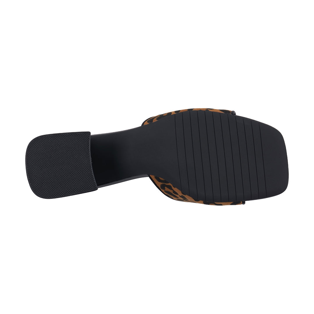 Black sandal with leopard print trim on a white background