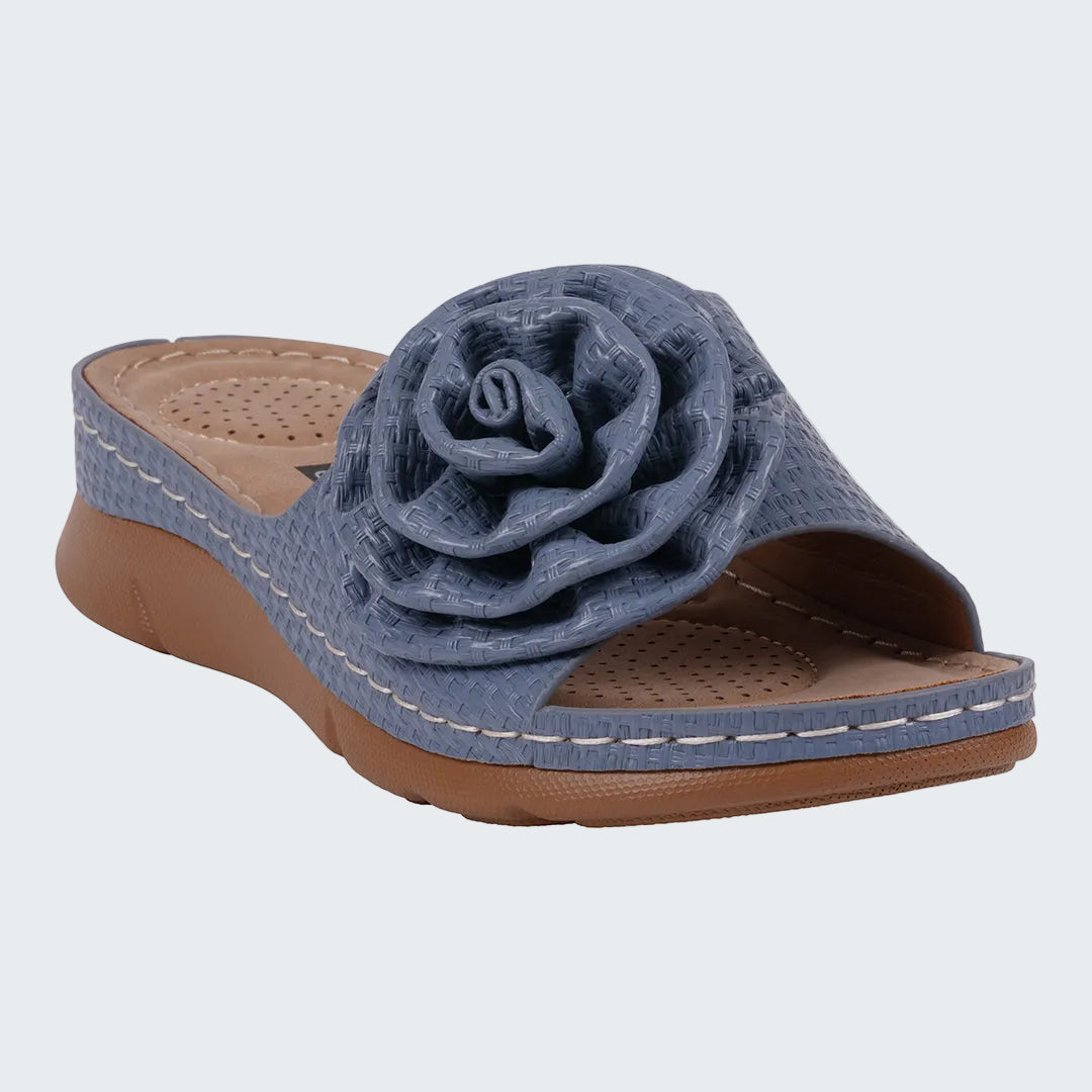 Blue sandal with a rose design on a white background