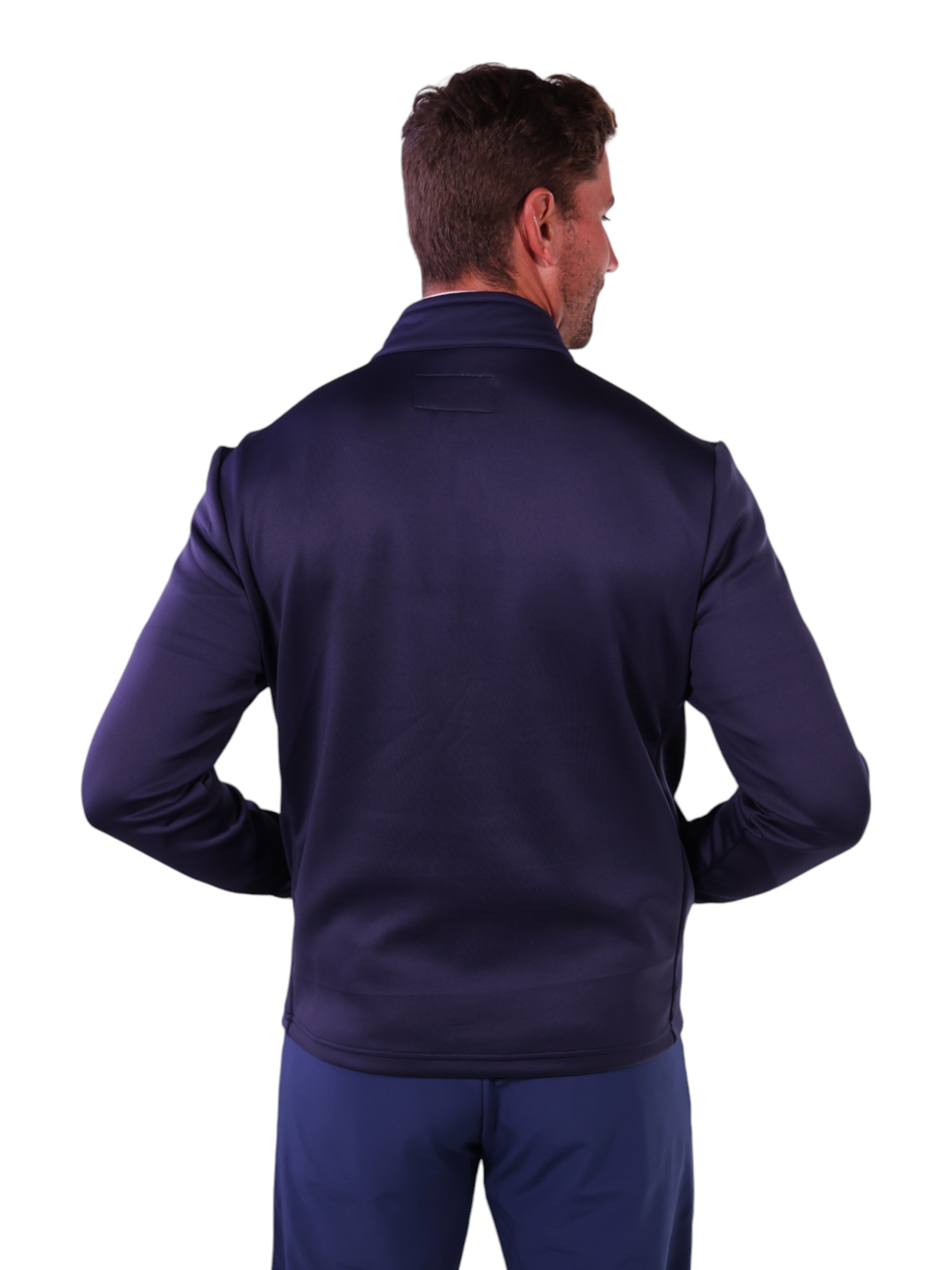 Man wearing a navy blue jacket and pants on a white background