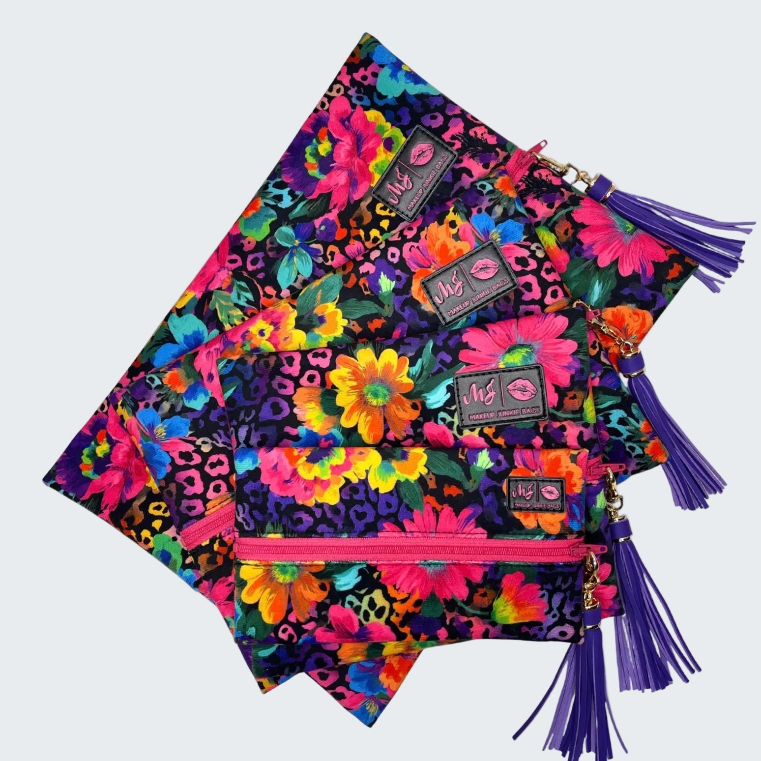 Colorful patterned bags with tassels on a white background