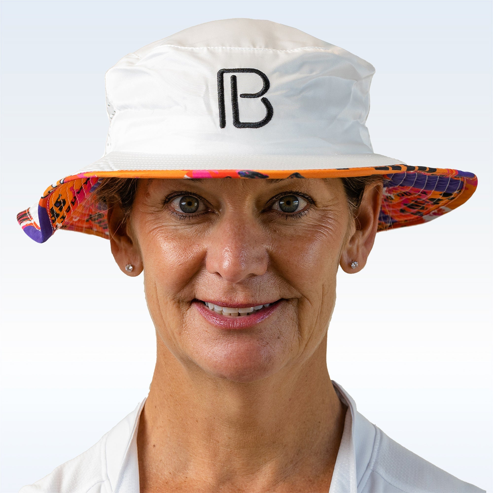 Person wearing a colorful hat with a logo on a light blue background