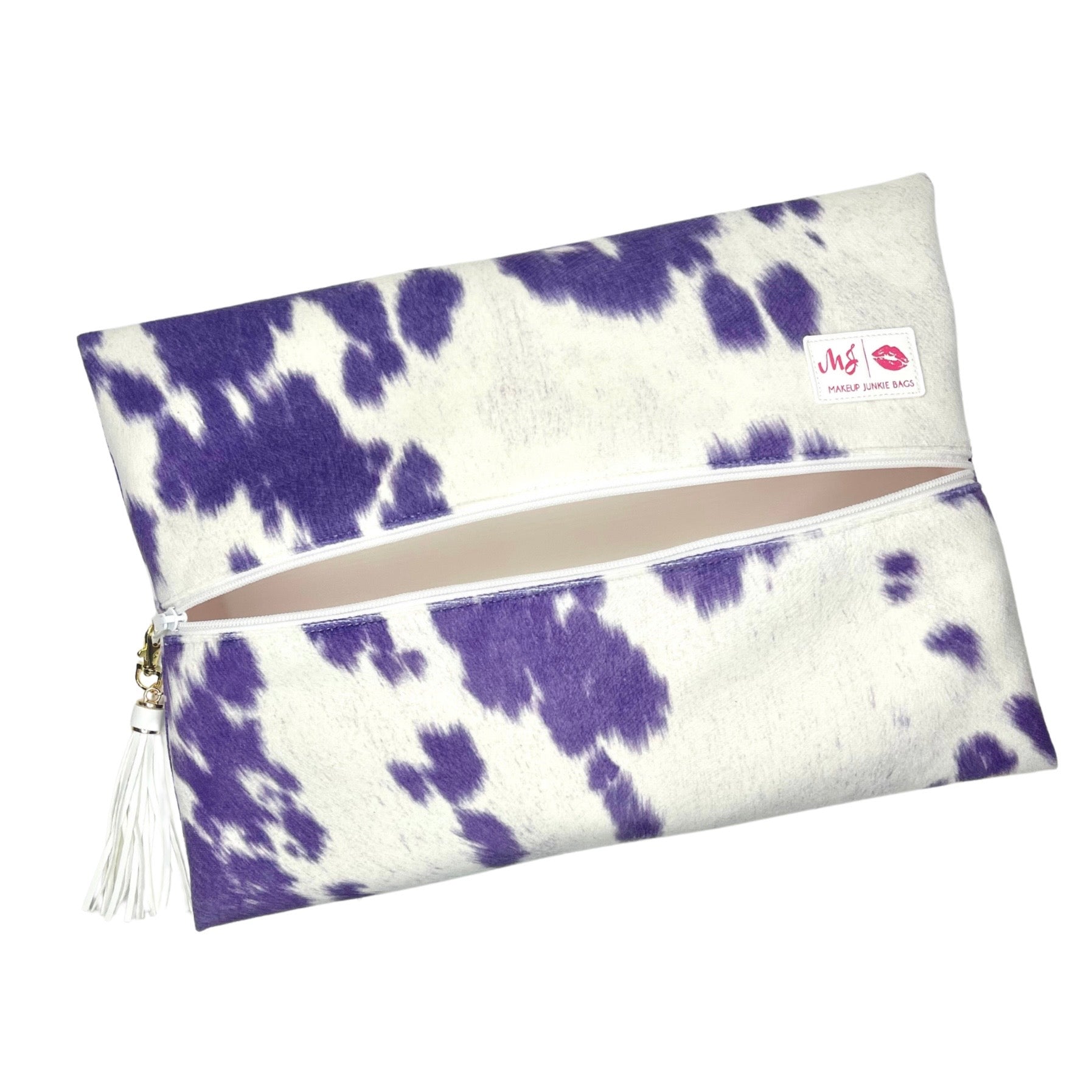 Purple and white cow print pouch with a visible brand logo on a white background