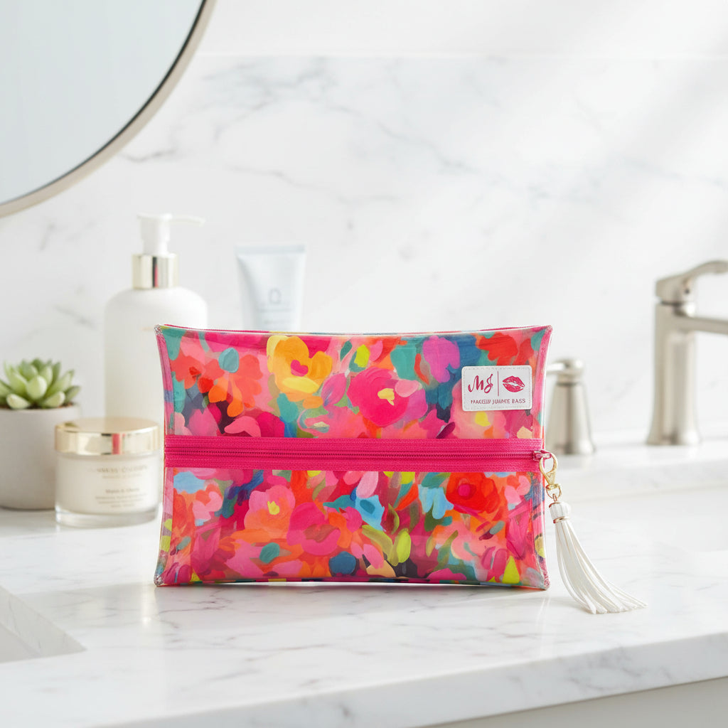 Colorful floral pouch with a pink zipper on a white background