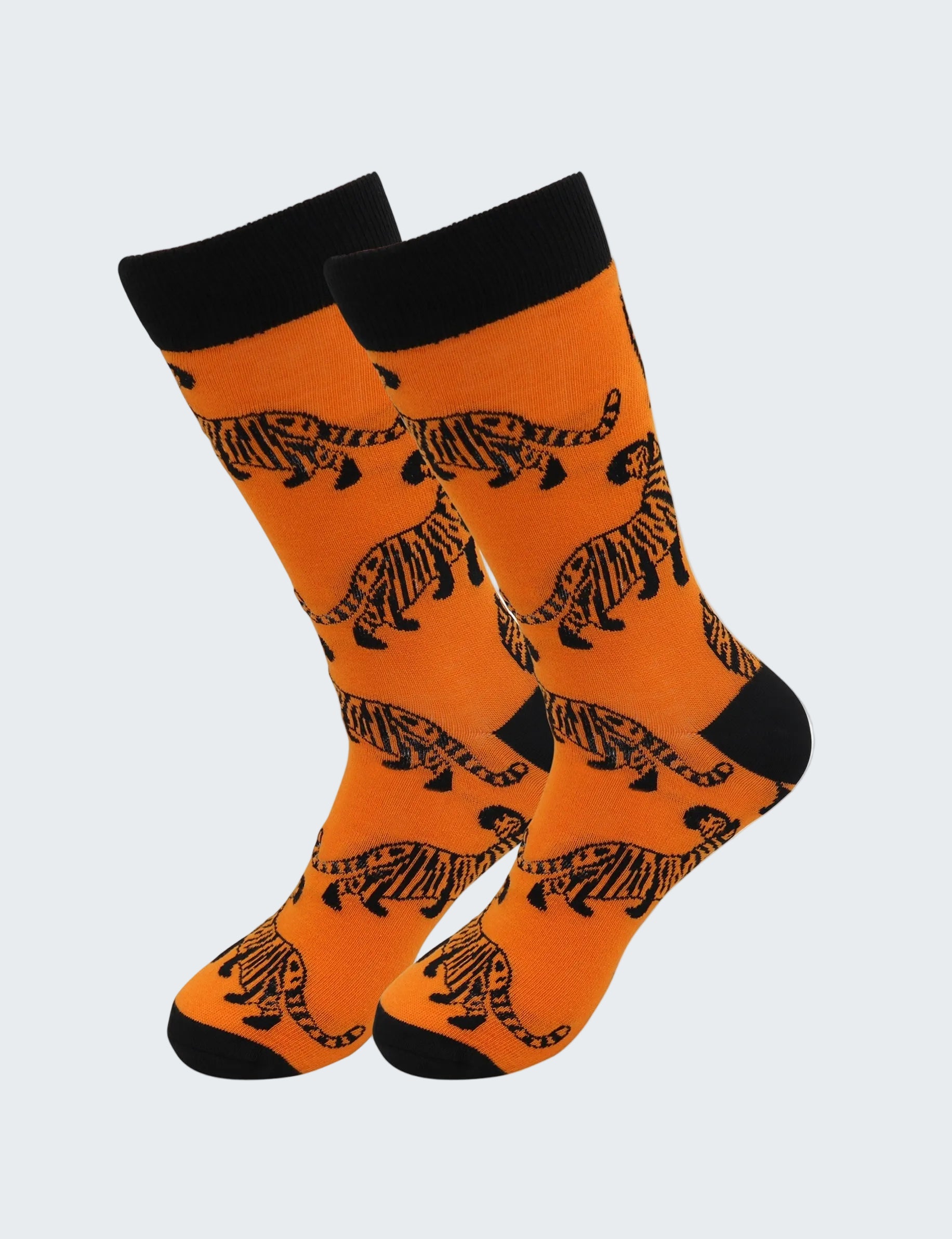 Orange socks with black tiger patterns on a white background