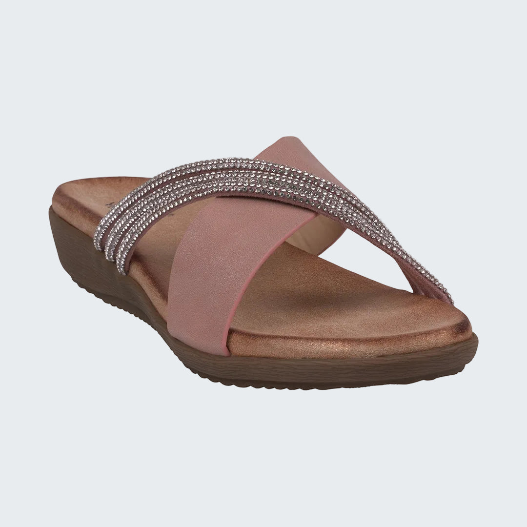 Pink sandal with brown sole on a white background